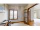 Home office with wood flooring and double doors at 9699 Prairiewood Way, Carmel, IN 46032