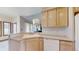 Kitchen with corner sink and white appliances at 9699 Prairiewood Way, Carmel, IN 46032