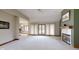 Living room with fireplace and lots of natural light at 9699 Prairiewood Way, Carmel, IN 46032