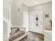 Staircase and entryway with neutral color scheme and wood flooring at 12833 Clifford Cir, Carmel, IN 46032