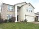 Two story home with brick and vinyl siding and a two-car garage at 14934 Dry Creek Rd, Noblesville, IN 46060