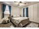 Bedroom with double bed, ceiling fan, and teal curtains at 1708 S Randolph St, Indianapolis, IN 46203