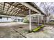 Covered carport with concrete parking area at 1708 S Randolph St, Indianapolis, IN 46203