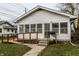 White house with porch, ramp, and small yard at 1708 S Randolph St, Indianapolis, IN 46203