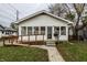 White house with porch, ramp, and small yard at 1708 S Randolph St, Indianapolis, IN 46203