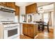 Kitchen with oak cabinets and white appliances at 1708 S Randolph St, Indianapolis, IN 46203