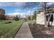 Sidewalk leading to neighborhood entrance with manicured lawn at 2129 Spring Briar Ct, Avon, IN 46123