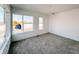 Bright bedroom with neutral carpeting and large windows offering ample natural light at 2151 N College Ave, Indianapolis, IN 46202