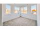 Bright bedroom with large windows and carpeted floor at 2151 N College Ave, Indianapolis, IN 46202