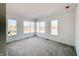 Spacious bedroom with multiple windows and carpet at 2151 N College Ave, Indianapolis, IN 46202