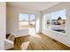 Bright bonus room with large windows and wood-look flooring at 2151 N College Ave, Indianapolis, IN 46202