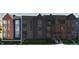 Modern 3-story townhome with brick and blue siding, steps, and a small yard at 2151 N College Ave, Indianapolis, IN 46202