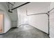 Attached garage with concrete floor and ample space for two cars at 2151 N College Ave, Indianapolis, IN 46202