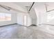 Spacious garage with concrete flooring, overhead door and extra storage at 2151 N College Ave, Indianapolis, IN 46202