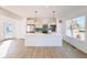 Modern kitchen with white cabinets, quartz countertops, and stainless steel appliances at 2151 N College Ave, Indianapolis, IN 46202