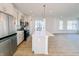 Modern kitchen island with white cabinets and quartz countertops at 2151 N College Ave, Indianapolis, IN 46202