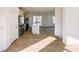 Open concept kitchen with island and stainless steel appliances at 2151 N College Ave, Indianapolis, IN 46202