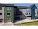 Rear view of townhomes showcasing garages and private patios at 2151 N College Ave, Indianapolis, IN 46202