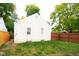 Large backyard with a wooden fence at 5601 Hillside Ave, Indianapolis, IN 46220