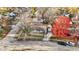 Aerial view of the house and neighborhood with vibrant fall foliage at 8902 Carla Dr, Indianapolis, IN 46219