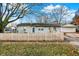 Cute ranch home with a white picket fence and detached garage at 8902 Carla Dr, Indianapolis, IN 46219