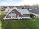 Brick home with patio, situated on a spacious lot with landscaping at 11736 Grazing Ln, Indianapolis, IN 46239