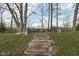 Stone steps leading to a seating area in the backyard at 11736 Grazing Ln, Indianapolis, IN 46239