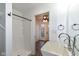 Bathroom with walk-in shower, modern sink, and laundry access at 11736 Grazing Ln, Indianapolis, IN 46239