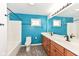 Bathroom with a double vanity, a shower and blue walls at 11736 Grazing Ln, Indianapolis, IN 46239