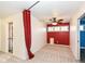 Bedroom with a red accent wall and built-in shelving at 11736 Grazing Ln, Indianapolis, IN 46239