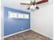 Bedroom with a blue accent wall and new flooring at 11736 Grazing Ln, Indianapolis, IN 46239