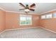 Bright bedroom with neutral carpeting and large windows at 11736 Grazing Ln, Indianapolis, IN 46239