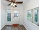 Bright entryway with wood-look floors and large mirror at 11736 Grazing Ln, Indianapolis, IN 46239