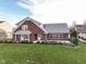 Brick home with a large backyard and mature trees at 11736 Grazing Ln, Indianapolis, IN 46239