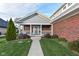Front porch with white columns and a swing at 11736 Grazing Ln, Indianapolis, IN 46239