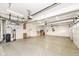 Three-car garage with epoxy flooring and extra storage at 11736 Grazing Ln, Indianapolis, IN 46239