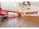 Kitchen with island, wood cabinets, and stainless steel appliances at 11736 Grazing Ln, Indianapolis, IN 46239