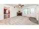 Living room with a brick fireplace, bay window and view to another room at 11736 Grazing Ln, Indianapolis, IN 46239