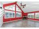 Spacious living room with vaulted ceiling, fireplace and large windows at 11736 Grazing Ln, Indianapolis, IN 46239