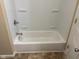 Clean bathroom with bathtub and tiled floor at 1221 W Memorial Dr, Muncie, IN 47302