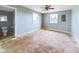 Main bedroom with exposed subfloor and ceiling fan at 31 S Superior St, Orestes, IN 46063
