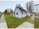 Gray siding house with a covered porch and a side yard at 31 S Superior St, Orestes, IN 46063