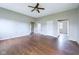 Living room with dark laminate flooring and a ceiling fan at 31 S Superior St, Orestes, IN 46063