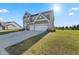 Two-story house with gray siding, three-car garage, and landscaped lawn at 4225 Edelweiss Dr, Plainfield, IN 46168