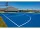 Blue outdoor basketball court with two hoops at 6322 Granby Dr, Whitestown, IN 46075