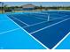 Blue pickleball and tennis court with net at 6322 Granby Dr, Whitestown, IN 46075