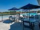 Relaxing poolside patio with tables and umbrellas at 6322 Granby Dr, Whitestown, IN 46075
