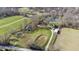 Aerial view of property with multiple structures and pond at 1155 Cope Rd, Martinsville, IN 46151
