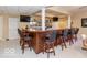 Well-appointed basement bar with ample seating and storage at 12954 Water Ridge Dr, Fishers, IN 46055