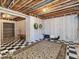 Unfinished basement area with checkerboard floor and storage at 12954 Water Ridge Dr, Fishers, IN 46055